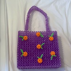 Susan Alexandra purple handbag with orange detail